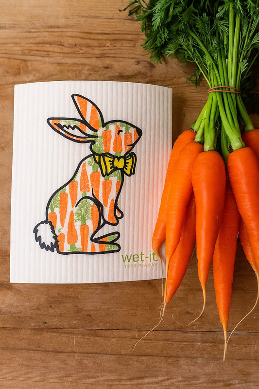 The Hungry Bunny Swedish Cloth with bunny in green bow tie and carrots design. Available sizes: 7"x8", 10"x12".