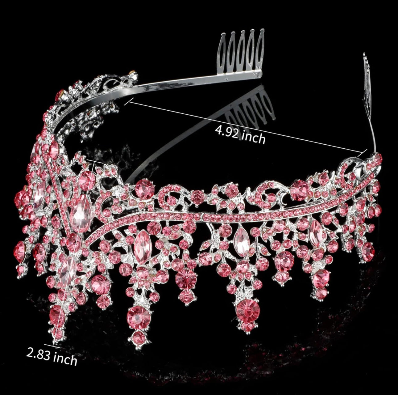Silver tiaras with pink gemstones, intricate details, and hanging gems. Size: 4.92" wide x 2.83" tall.