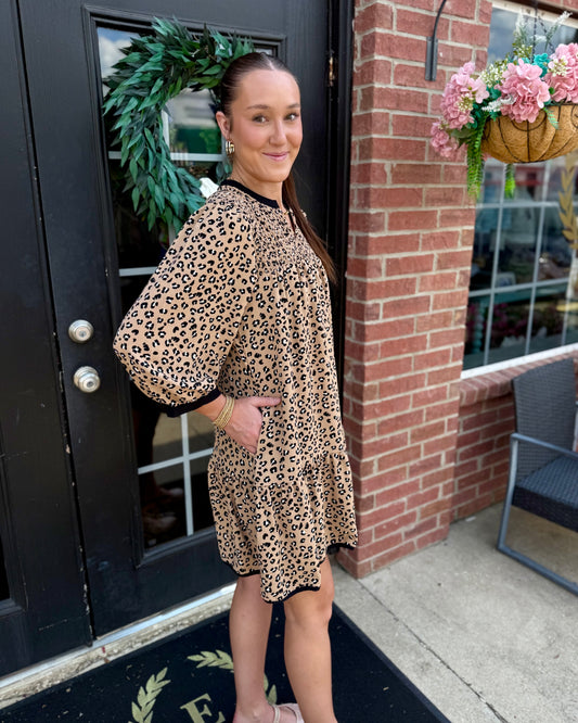 Audrey Leopard Print Smocked Dress features a relaxed silhouette and loose fit; available in sizes XS–XL.