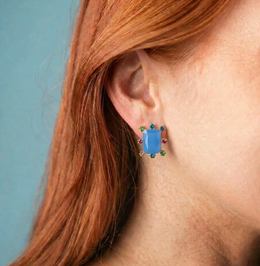 Rectangle Burst Stud Earrings with large rectangular blue stud and small multicolored gems around the edges; available in small, medium, and large sizes.