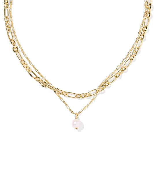 Gold layered necklace with figaro and rope chains, single freshwater pearl drop. Available in 16", 18", and 20" lengths.