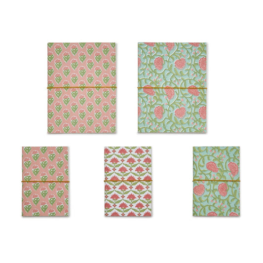 Set of 5 floral block print soft cover notebooks in pink, green, and white; handmade recycled cotton paper; sizes: A5, A6.