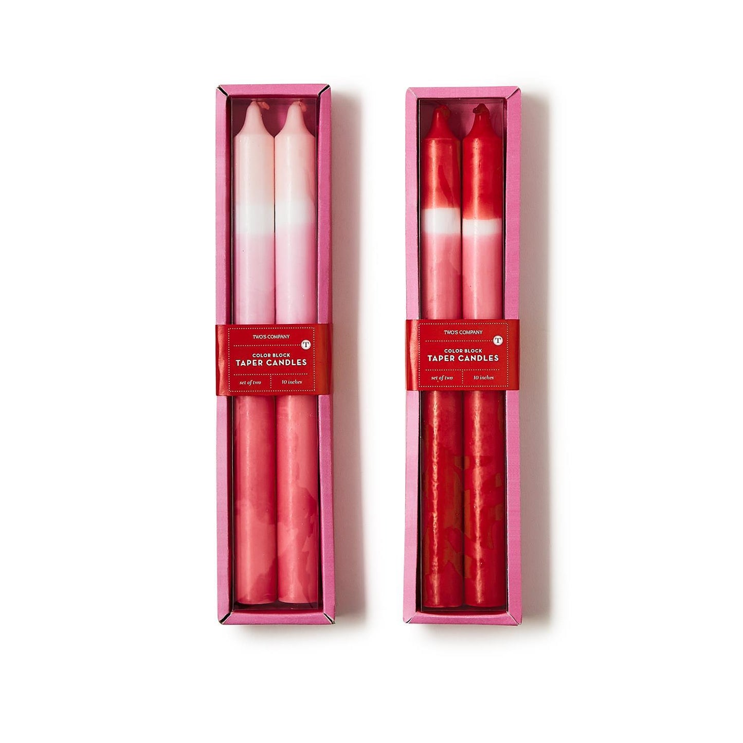 Color Block Taper Candles in pink boxes with red labels; one pink gradient, one red marbled. Available in 10" and 12" sizes.