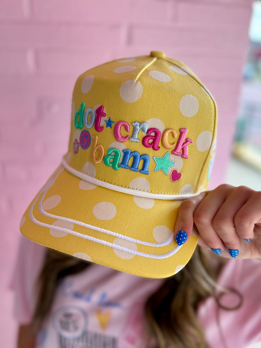 Dot Crack Bam Hat: yellow/white polka dots, colorful embroidered letters, stars, hearts, smiley face. Sizes: S/M, M/L.