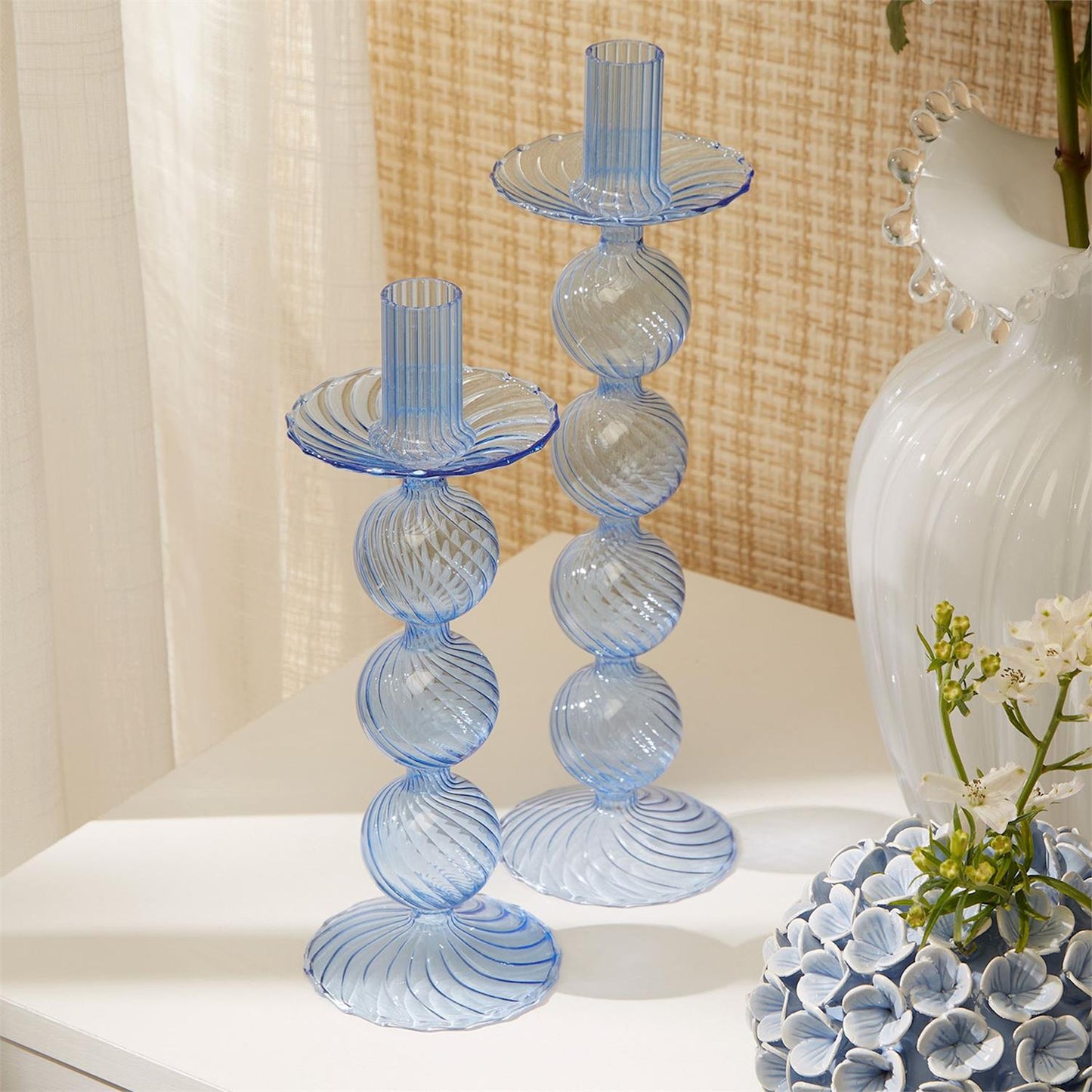 Two Blue Hand-Blown Glass Taper Candlesticks with spiral patterns. Sizes available: Standard height for taper candlesticks.