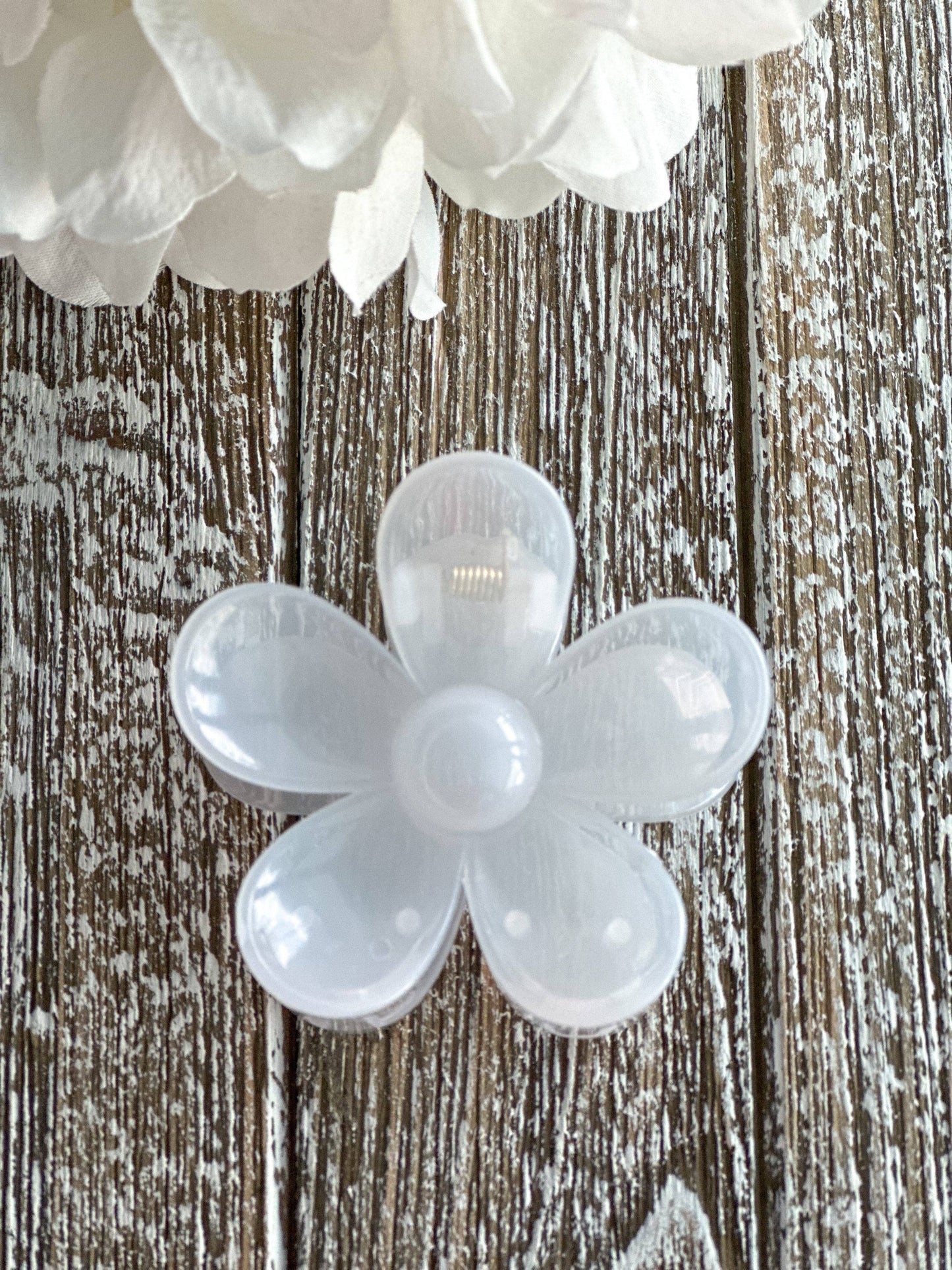 The Flower Power "White Shimmer" Hair Clip, translucent white bloom. Available in small and large sizes.