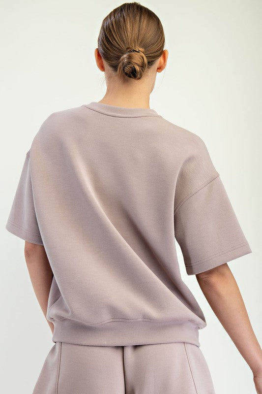 Loose, short-sleeve Modal Scuba Top shown; available in sizes XS-XL.