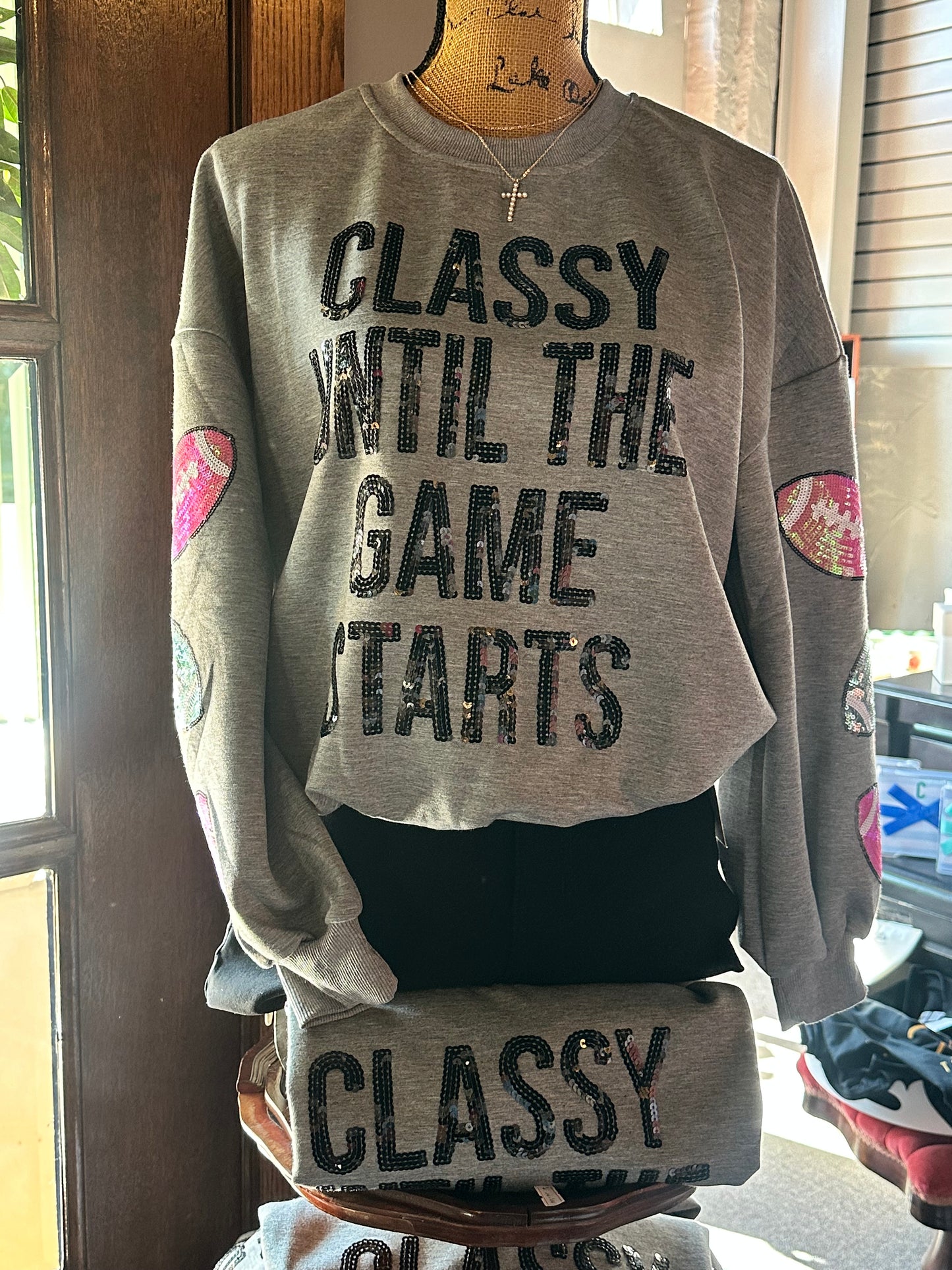 Classy Game Day Sweatshirt with black sequin text, pink/white sequin footballs on sleeves. Available in S-XL.