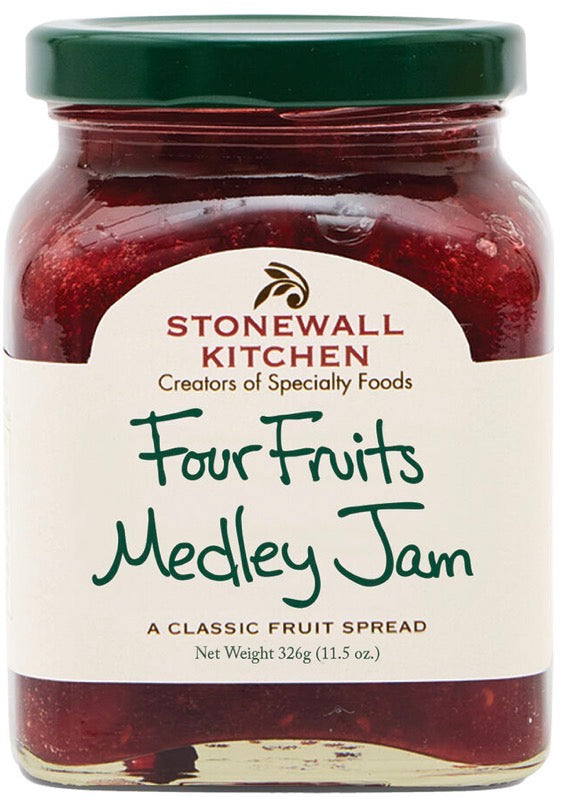 Glass jar of Four Fruits Medley Jam with a green lid and white label reading “A Classic Fruit Spread” and “Net Weight 326g (11.5 oz).” Available in 326g (11.5 oz) size.
