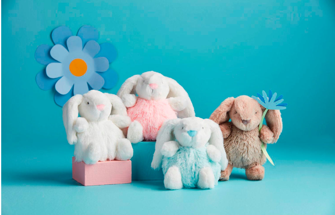 Pastel faux fur bunny pom pom rattles, one with blue flower detail. Available in small and medium sizes.