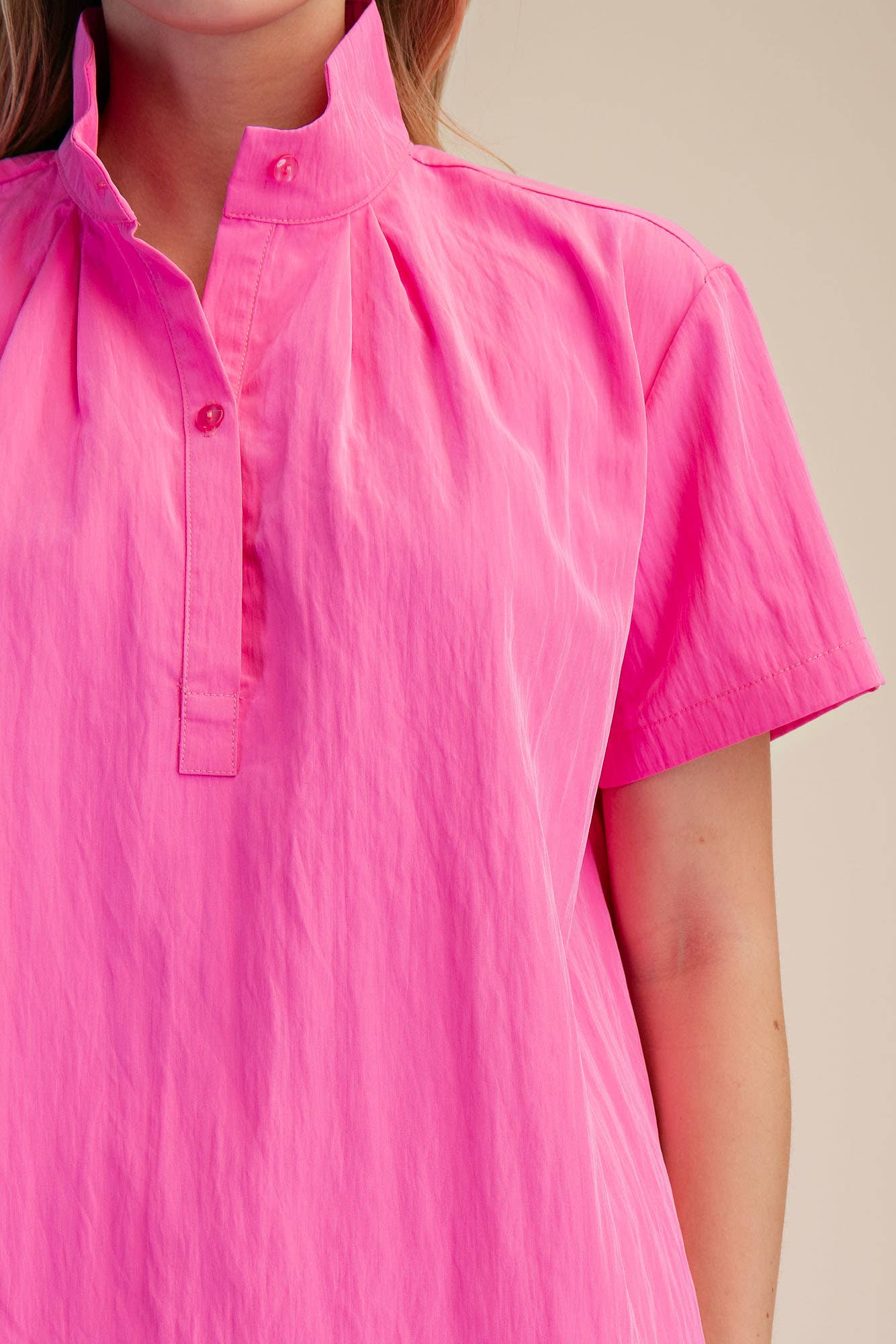 Pink Stand Collar Short Sleeves Shirt with neckline pleats and partial button placket. Available in sizes S-XL.