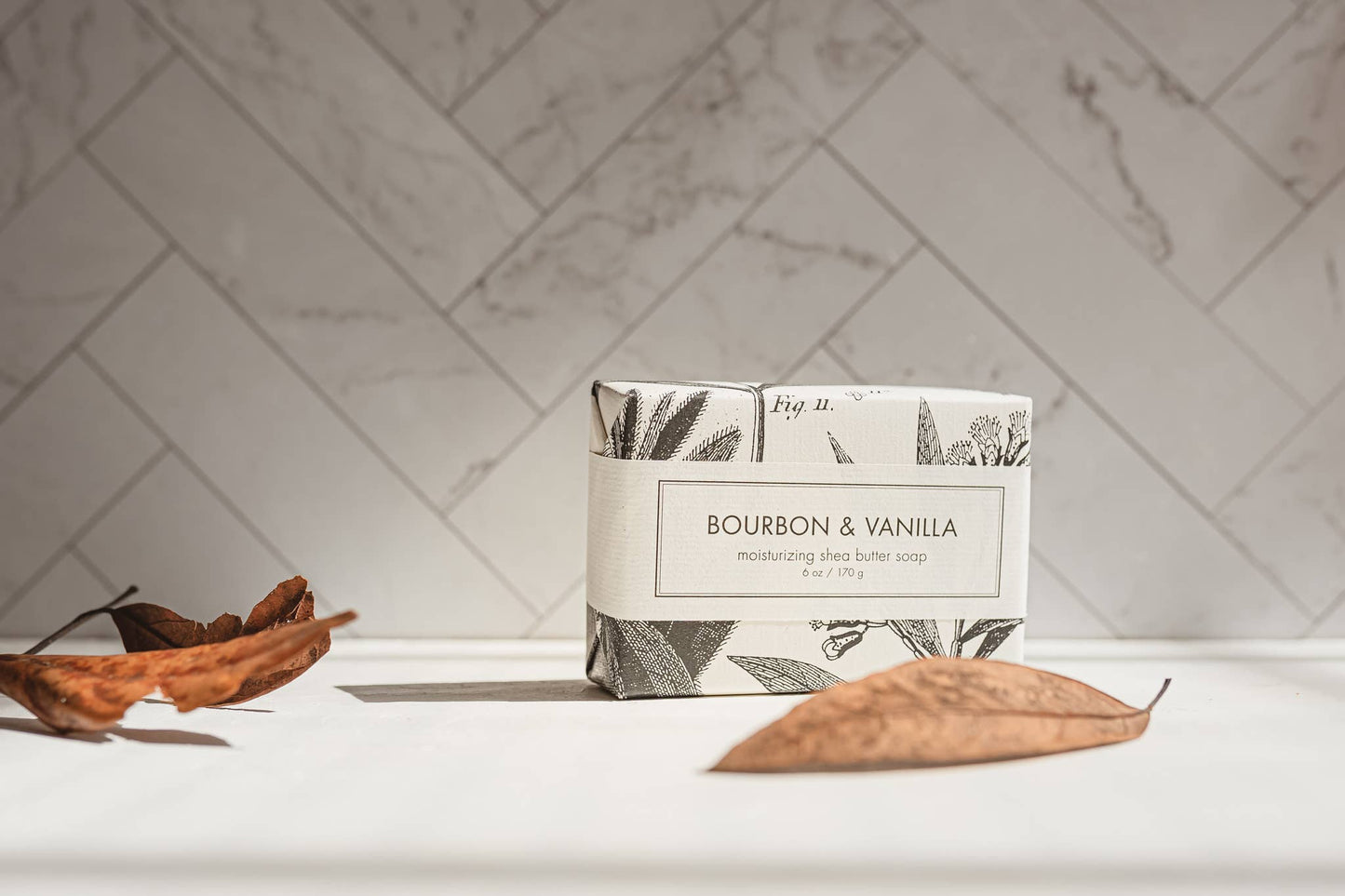The product is a box of Bourbon & Vanilla Soap - Bath Bar. It evokes a natural vibe. The soap is available in bar size only.