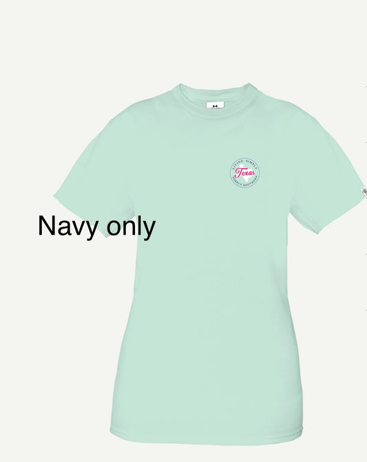 Mint green t-shirt with a small circular logo on the left chest area labeled "Texas" and text underneath saying "State TX Navy," available in multiple sizing options.