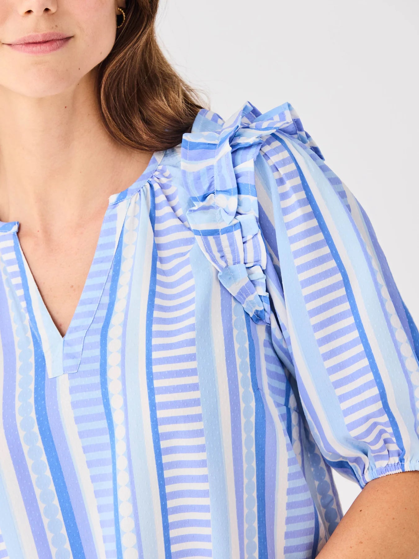 Skylar Simply Striped Blue Top with blue and white stripes, ruffled shoulders. Available in S, M, L.