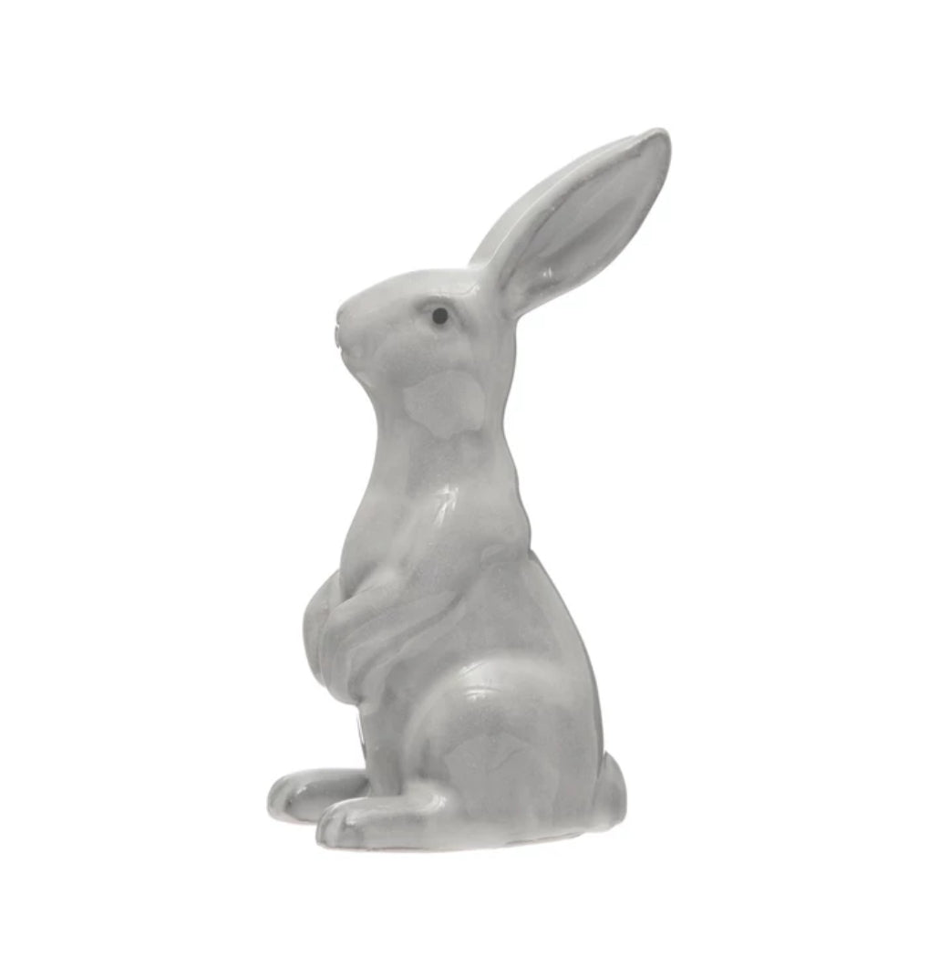 Glossy white stoneware rabbit with raised paws and upright ears. Available in 8" and 12" sizes. Polished reactive glaze finish.