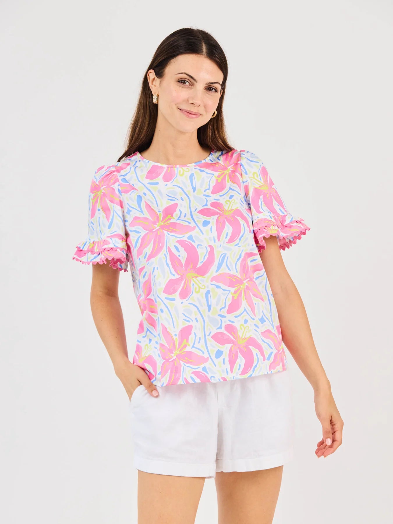 Cassidy Hibiscus Harmony White Top: floral short-sleeves, ruffled edges, scallop trim, crew neck. Available in XS-XL.