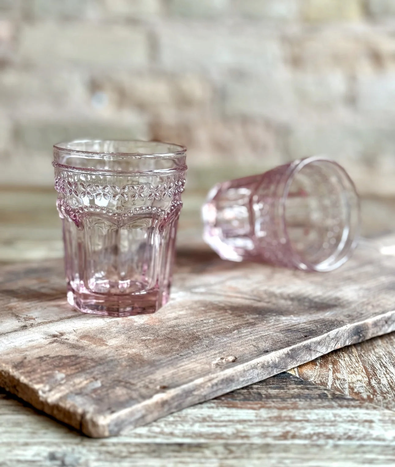 Set of two pink pressed glass Marseille & Remi Blush tumblers; available in 8oz and 12oz sizes.