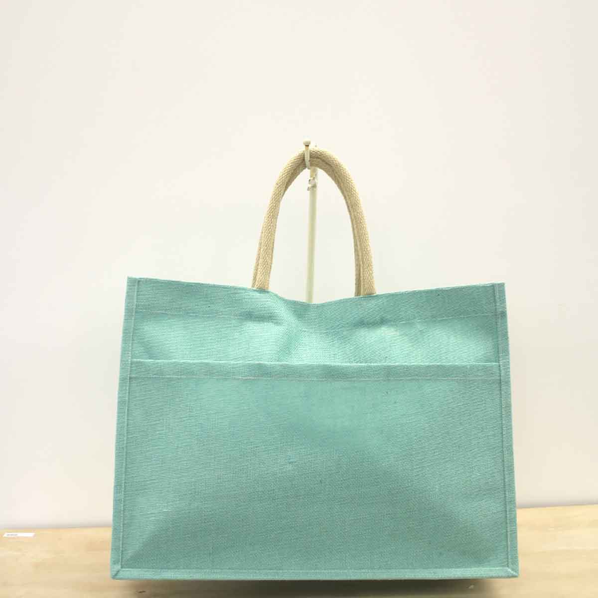 Jute Pocket Tote with light blue fabric and beige woven handles. Available in small, medium, and large sizes.