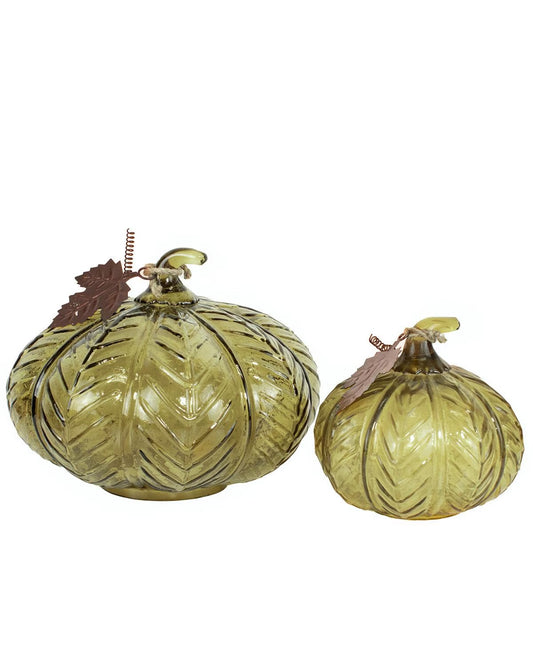 Set of two Darby Pumpkins in translucent olive green glass with leaf patterns and metal leaf accents, available in large and small sizes.