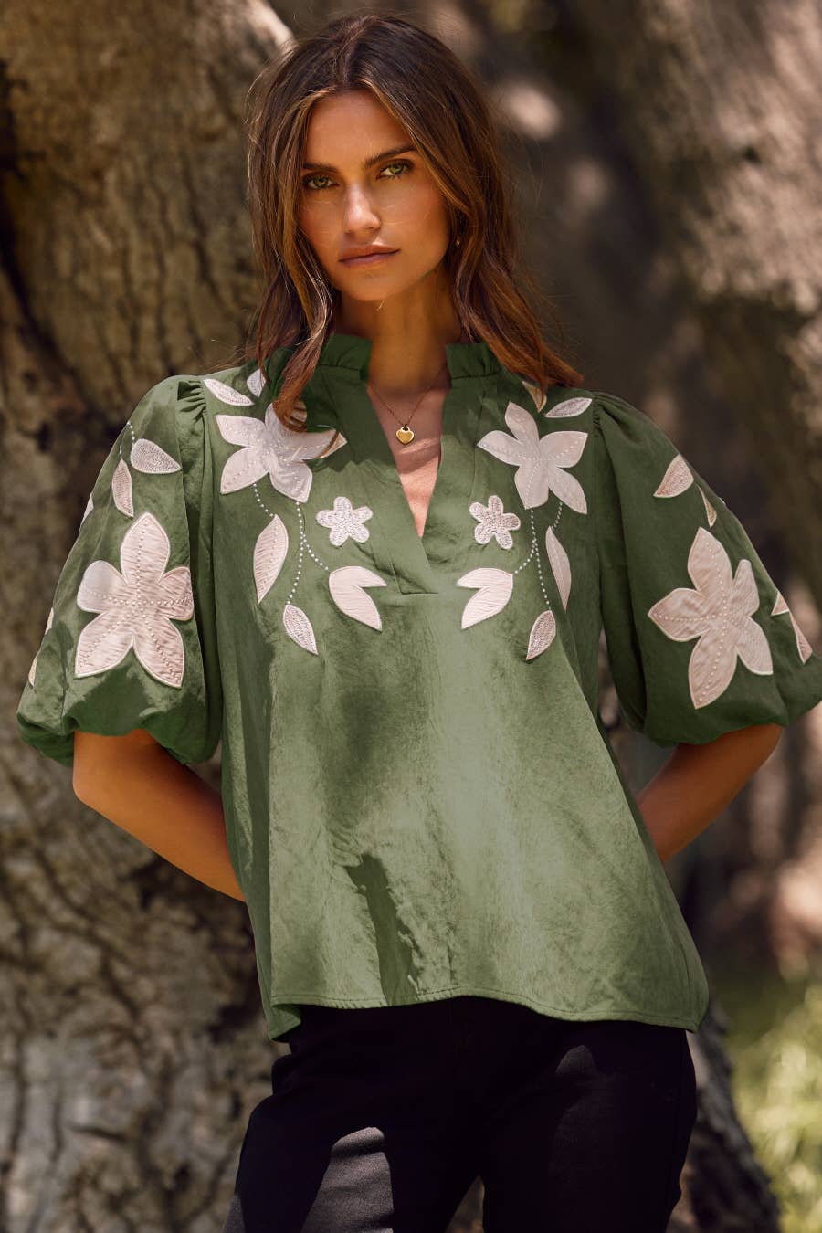 Washed suede top in camel, available in sizes XS–XL.
