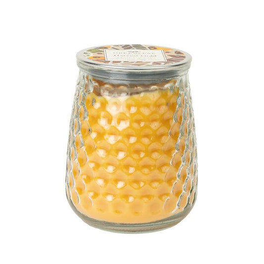 Harvest Gold Signature Candle 13 oz in yellow, glass jar with honeycomb pattern, silver lid, and labeled top.