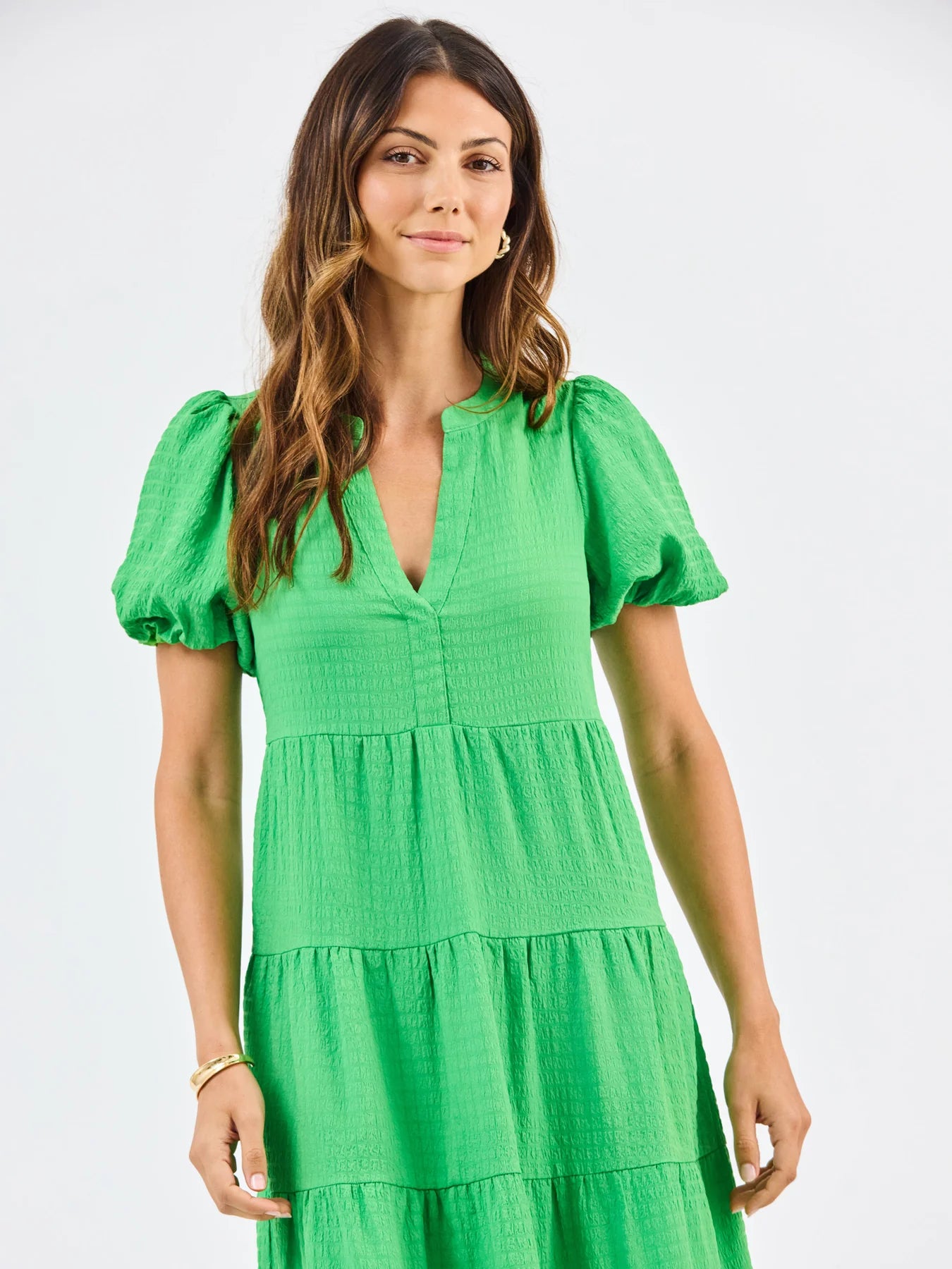 Kinsley Green Seersucker Dress: tiered midi with V-neckline. Available in sizes XS–XL.