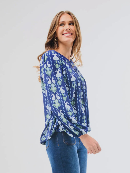 Janelle Top Ikat Stripe: blue patterned blouse with notched neckline, long sleeves. Available in sizes XS-XL.