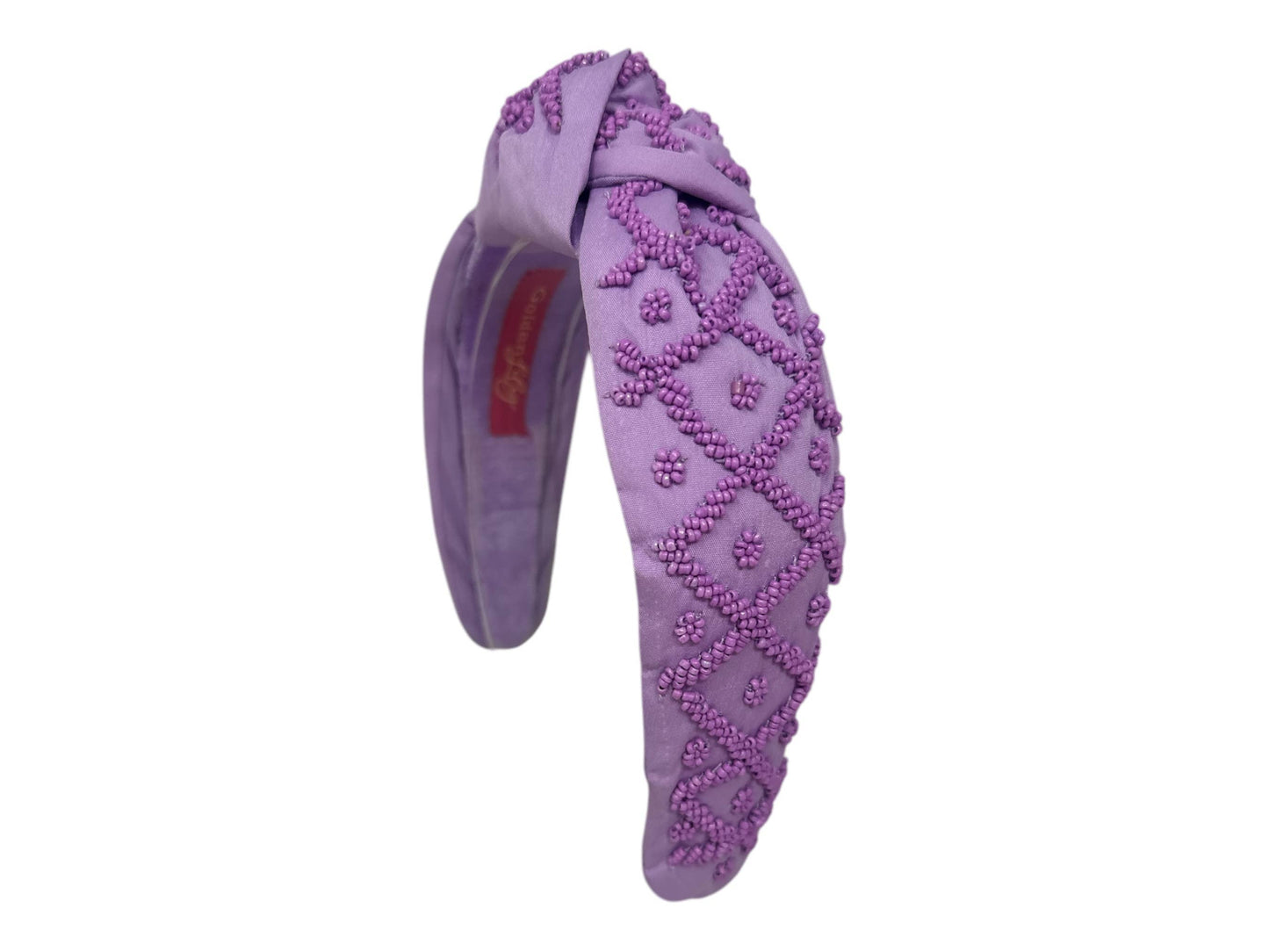 Padded purple knot headband with beaded diamond pattern embroidery. Available in S, M, L sizes.