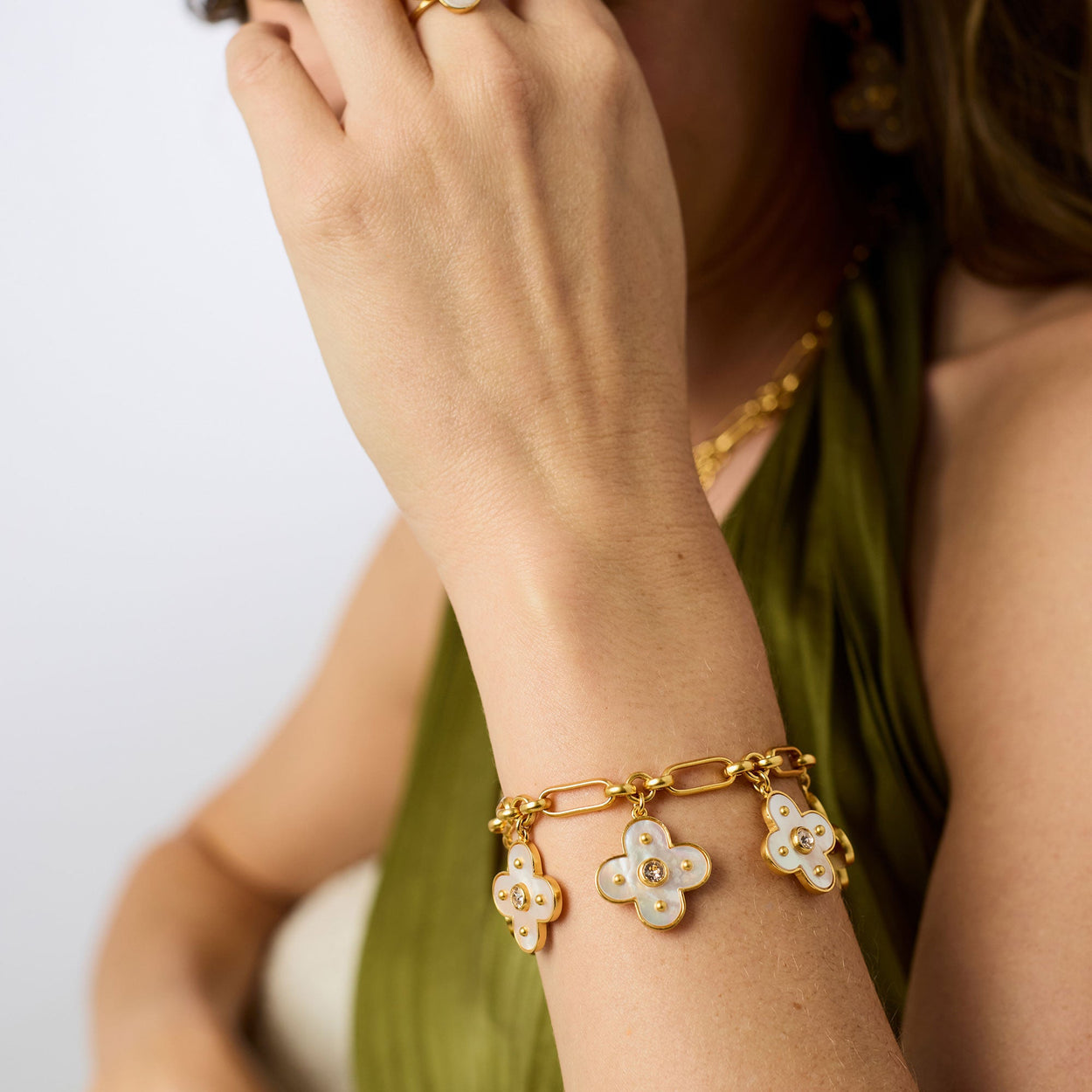 Colette Charm Bracelet - Champagne: three white clover charms with pearls and mother of pearl. Available in S, M, L.