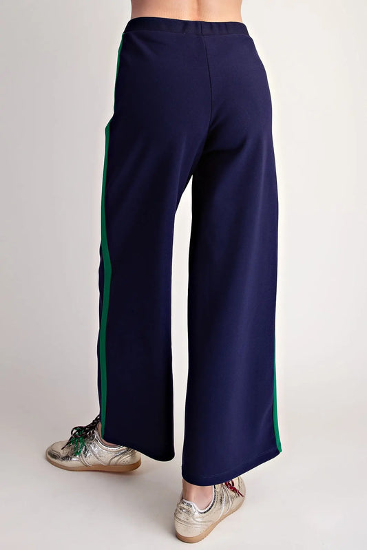 Everyday Pull-on Contrast Pants in navy blue with green side stripes, available in sizes XS-XL.