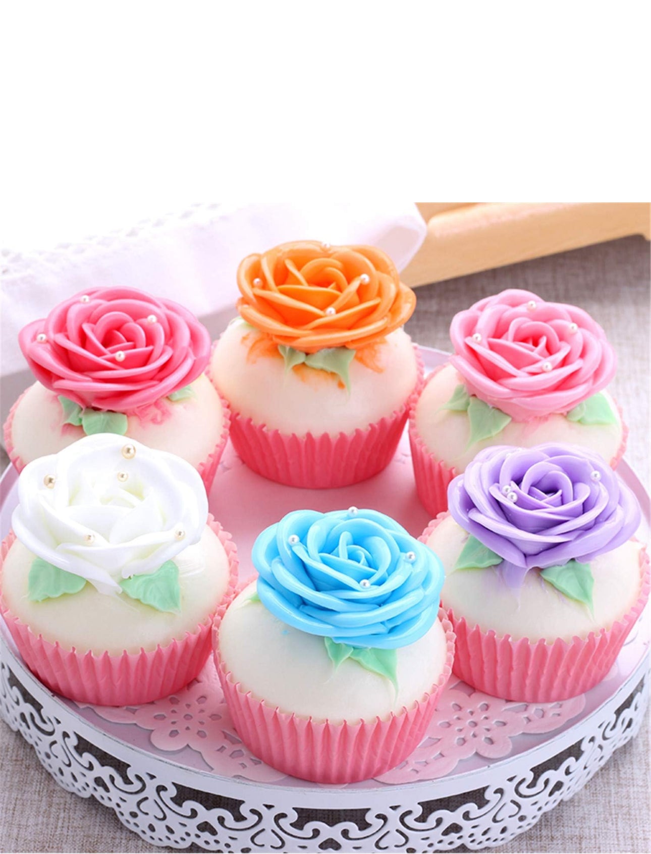 Six faux cupcakes with pastel rose frosting in pink wrappers. Available sizes: small, medium, large.