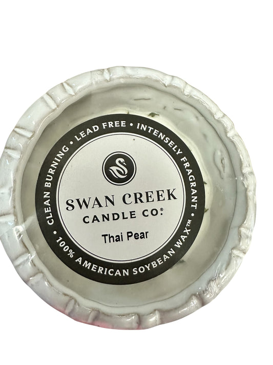 Round white soy candle, "Swan Creek Candle Co.: Thai Pear" label, 100% soy wax, 30-hour burn. Size: Small fluted pot.