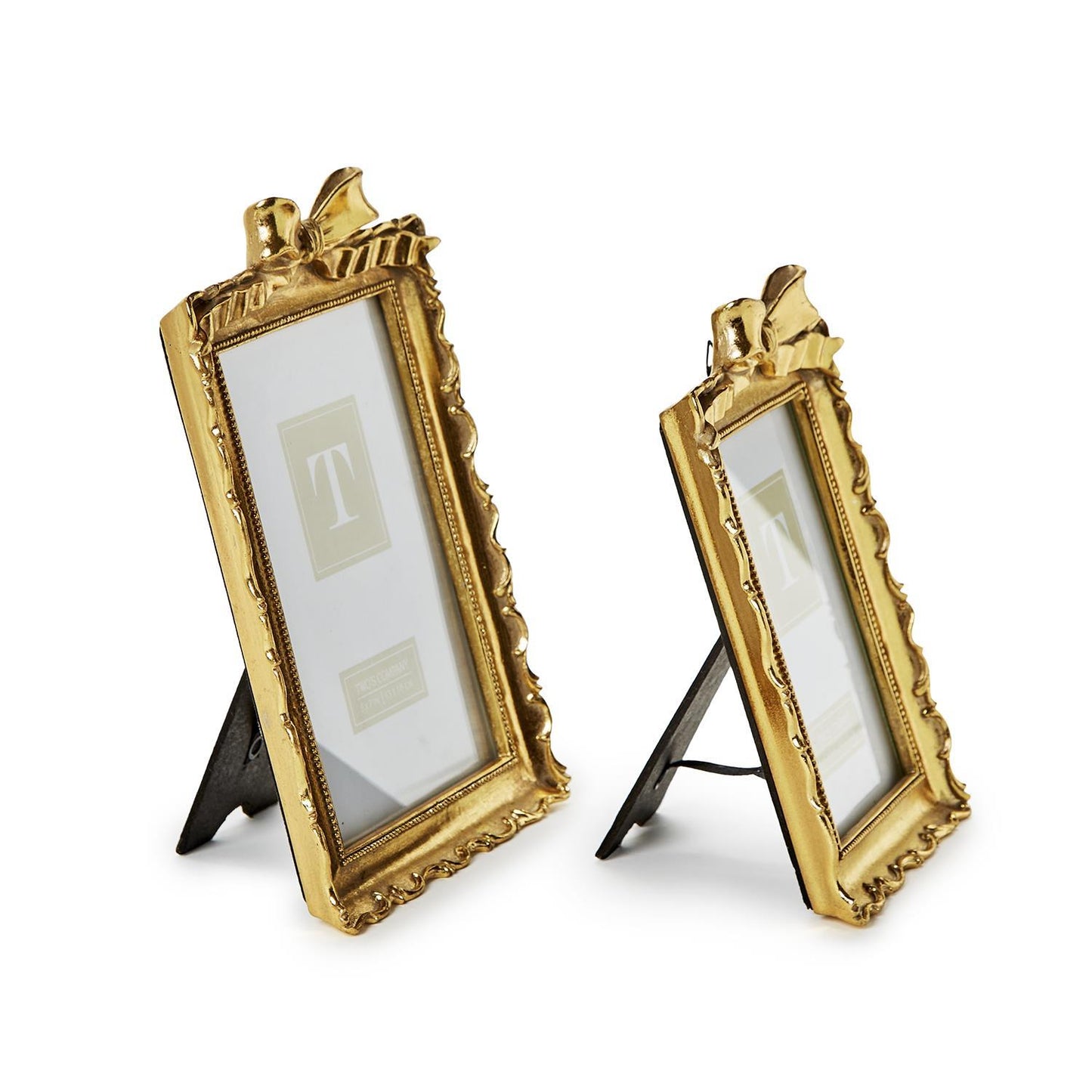 Set of two gold photo frames with decorative bows, black easel backs; sizes: one small, one slightly larger.