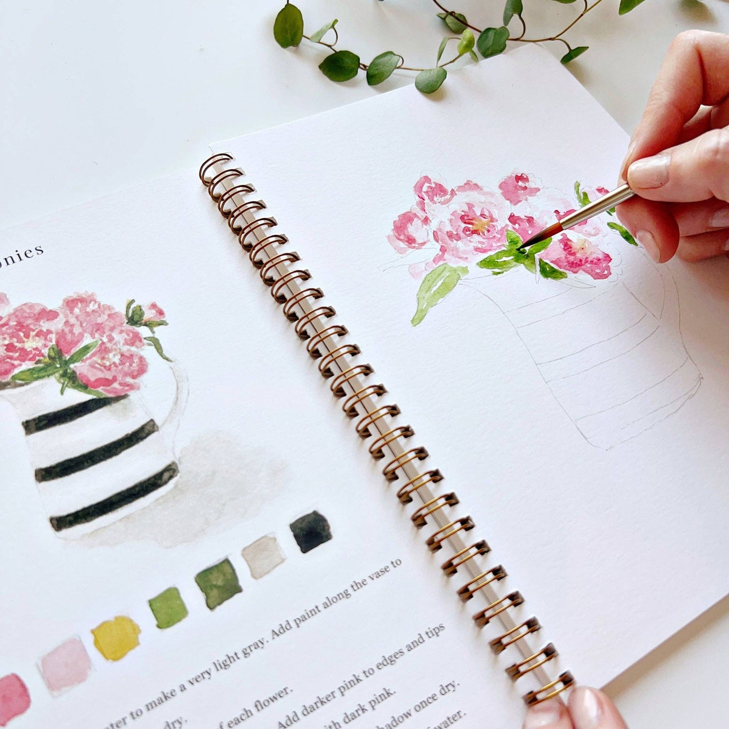 Bouquets Watercolor Workbook in use; shows painted flowers. Available sizes: standard and large.