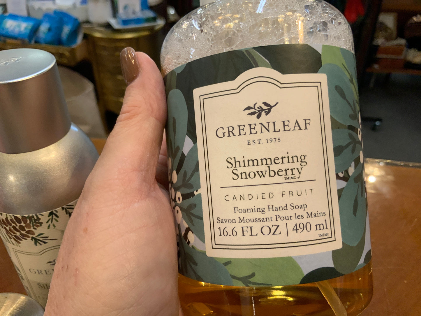 16.6 fl oz (490 ml) Shimmering Snowberry Foaming Soap, "Candied Fruit," decorative label, bubbles in clear bottle.
