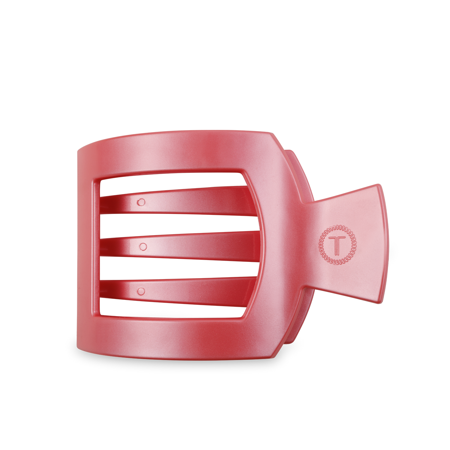 Red plastic hair clip with strong grip, three horizontal slits, and "T" emblem. Available sizes: medium, large.