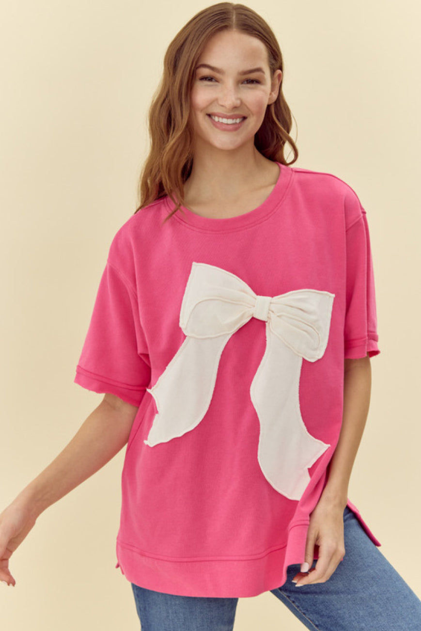 Pink Ribbon Shirt: Bright pink, oversized top, short sleeves, large white bow on the front. Sizes available: S, M, L, XL.