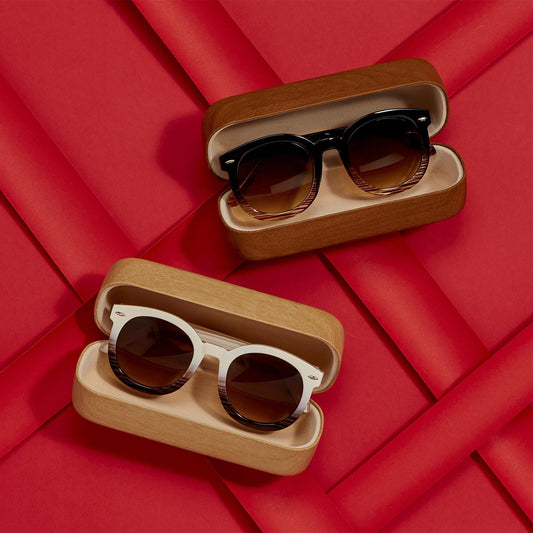 White and black Fade Frame Sunglasses in open cases. Available sizes: small, medium, large.