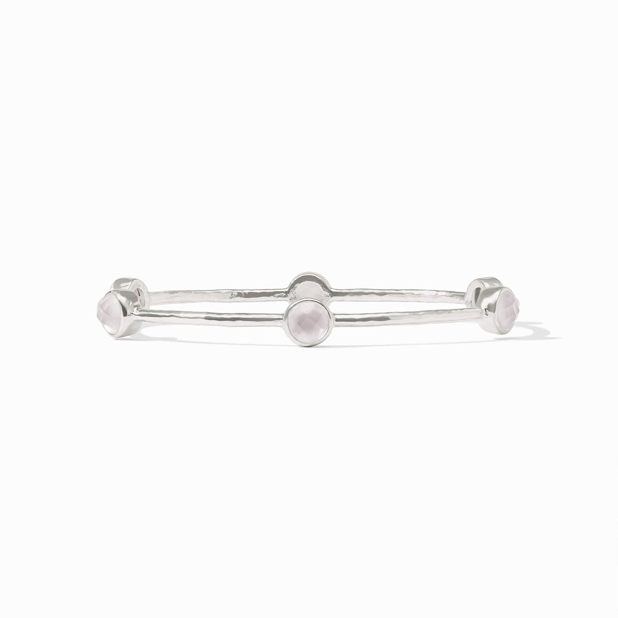 Silver bangle with five round pale pink gemstones on a textured band. Available in small, medium, and large sizes.