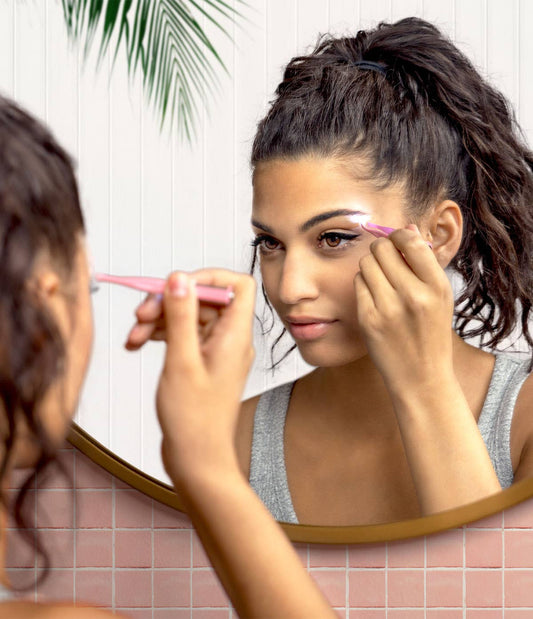 Lemon Lavender Light Up Tweezer shown in use for eyebrow grooming; available in standard and mini sizes.