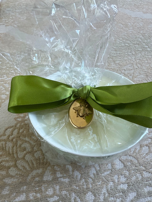 French Bee Candles white bowl, wrapped in clear cellophane with green ribbon and gold medallion. Available in small and large.