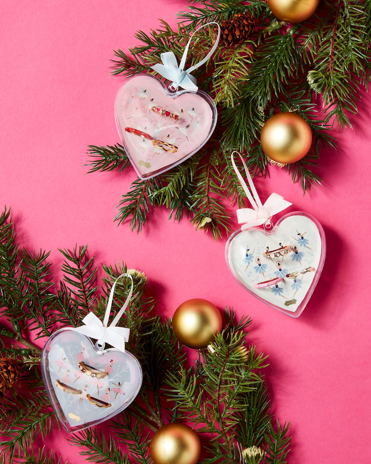 Three heart-shaped Ballerina Ornament Ring Set with bows; available in small, medium, and large sizes.
