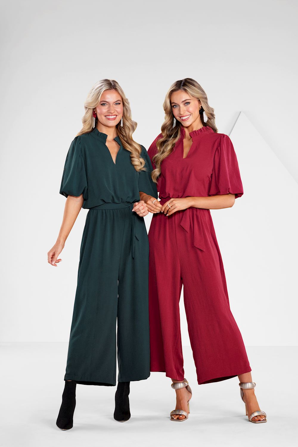 Annalise Jumpsuit shown in dark green and red; available in sizes XS-XL.