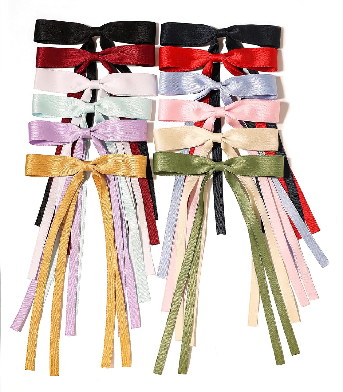 Set of nine large bow hair clips with long ribbons in assorted colors. Available in one size; each bow measures approx. 7 inches.