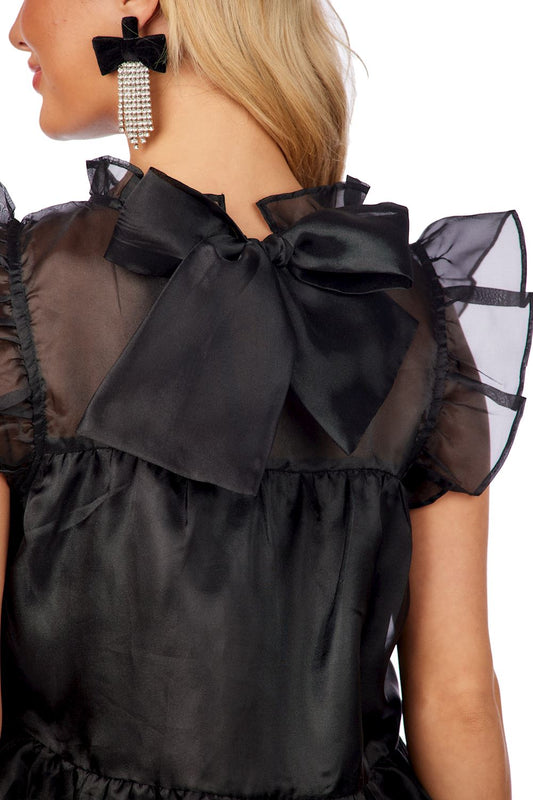 Jane Holiday Dress: sheer black top, ruffled sleeves, satin back bow. Available in sizes XS-XL. Special occasion style.