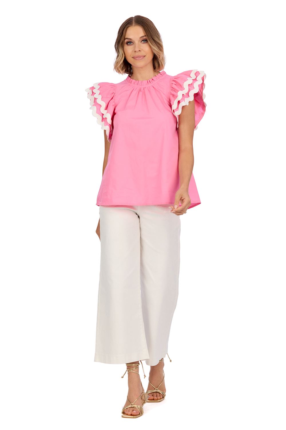 Angie Ric Rac Top features flutter sleeves and a playful ric rac design. Available sizes: XS, S, M, L, XL.