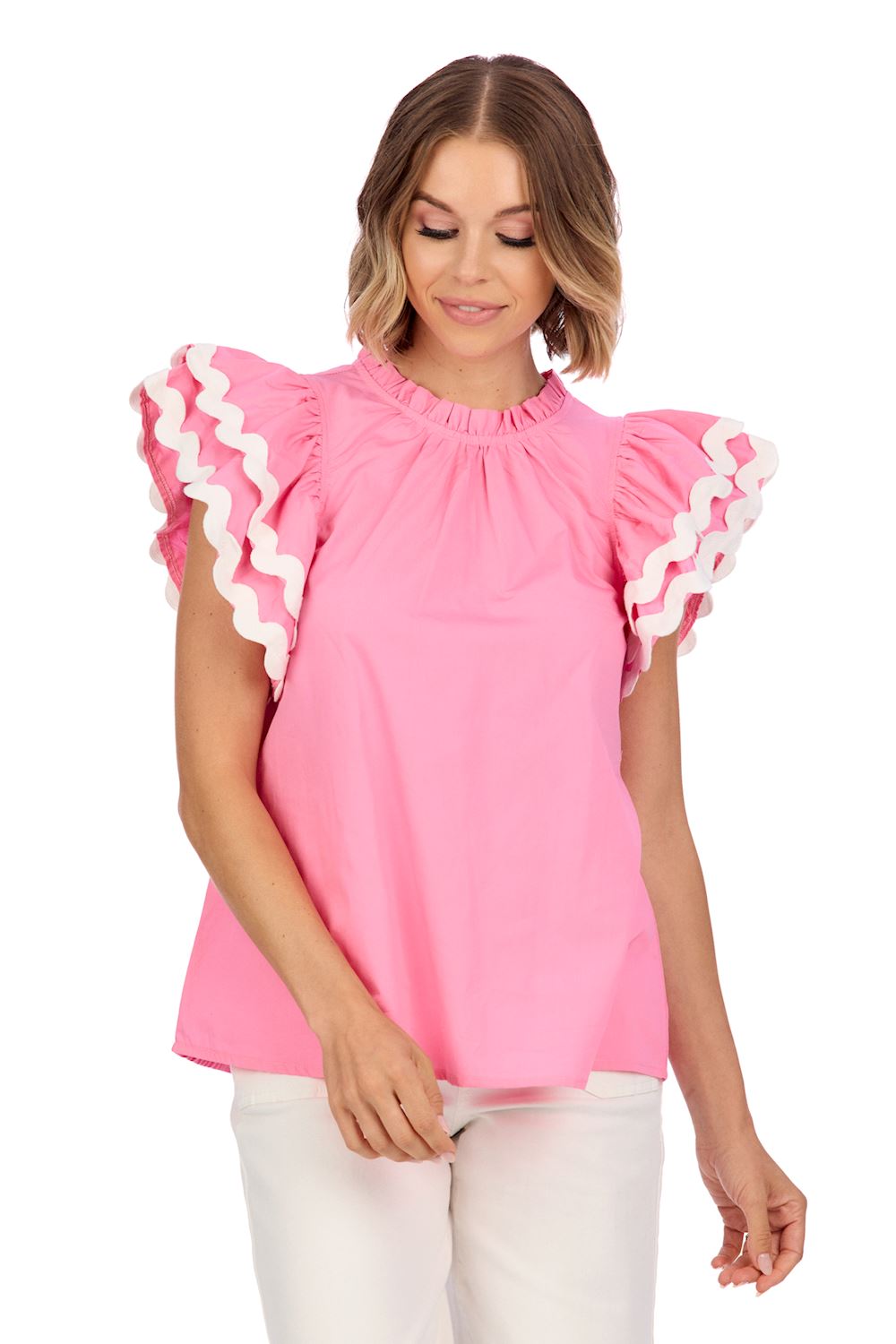 Angie Ric Rac Top: Pink blouse with ruffle neckline, flutter sleeves, and white wavy trim. Available sizes: XS, S, M, L.