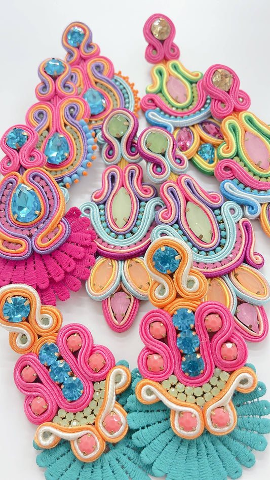 Colorful, handcrafted beaded earrings with bright threads and gemstones. Available in small, medium, and large sizes.