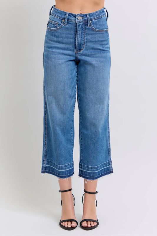 Judy Blue HW Control Release Hem Crop Wide jeans with frayed hems; available in sizes 24-32.