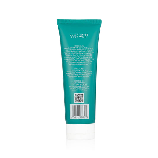 Back of teal "True Ocean Body Wash" tube, 8.5 oz size, with text and QR code emphasizing a coastal scent.